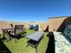 Inviting rooftop deck with outdoor furniture and artificial turf for relaxing and entertaining at 384 Gracious Way, Henderson, NV 89011
