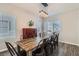 Elegant dining area with stylish light fixture, ample natural light, and seating for ten at 3925 Champagne Wood Dr, North Las Vegas, NV 89031