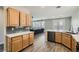 Bright, open kitchen with wood cabinets, stainless appliances, and a view into the living room at 3925 Champagne Wood Dr, North Las Vegas, NV 89031