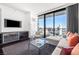 Stylish living room with a balcony offering city views at 4381 W Flamingo Rd # 2504, Las Vegas, NV 89103