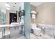 Elegant bathroom featuring a double vanity with marble countertops, a modern toilet, and sleek fixtures at 4381 W Flamingo Rd # 2504, Las Vegas, NV 89103