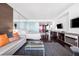 Stylish bedroom featuring a comfortable couch, a glass coffee table and a large TV, perfect for relaxing and entertaining at 4381 W Flamingo Rd # 2504, Las Vegas, NV 89103