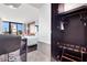 Open layout with a bed and city views, plus a wardrobe with hangers and luggage rack to enhance the room's luxury at 4381 W Flamingo Rd # 2504, Las Vegas, NV 89103