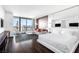 Stylish bedroom with a sleek bed, city views from the balcony, and a modern TV, offering comfort and convenience at 4381 W Flamingo Rd # 2504, Las Vegas, NV 89103