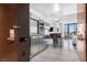 Modern kitchenette featuring stainless steel appliances and marble floors, offering a sleek and functional space at 4381 W Flamingo Rd # 2504, Las Vegas, NV 89103