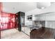 Contemporary kitchenette features stainless steel appliances, marble floors, and wooden breakfast bar at 4381 W Flamingo Rd # 2504, Las Vegas, NV 89103