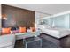Modern living room with a comfortable couch, a glass table, and pops of color, offering a stylish and inviting space at 4381 W Flamingo Rd # 2504, Las Vegas, NV 89103