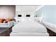 Modern main bedroom with large mirror accents, soft lighting, and views of the sitting area at 4381 W Flamingo Rd # 2504, Las Vegas, NV 89103