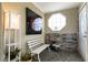 Cozy entryway featuring unique octagonal window, brick accents, and a decorative light fixture at 4726 Idaho Ave, Las Vegas, NV 89104