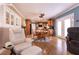Open-concept space combining living and dining areas, featuring wood floors and plenty of seating at 4726 Idaho Ave, Las Vegas, NV 89104