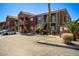 Apartment buildings showcasing common areas, assigned parking and desert landscaping on a sunny day at 4730 E Craig Rd # 2190, Las Vegas, NV 89115