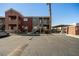 Apartment buildings exterior showing assigned parking spaces, palm trees and stairways at 4730 E Craig Rd # 2190, Las Vegas, NV 89115