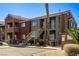 Exterior of apartment buildings with parking spaces and desert landscaping with various staircases at 4730 E Craig Rd # 2190, Las Vegas, NV 89115