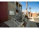 Apartment stairway leading to units showcasing exterior and common parking at 4730 E Craig Rd # 2190, Las Vegas, NV 89115