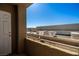 Balcony view overlooking the parking area with loading trucks on a clear day, next to a white door at 4730 E Craig Rd # 2190, Las Vegas, NV 89115