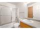 Bright bathroom features a shower-tub combo, a toilet, and a vanity with sink at 4730 E Craig Rd # 2190, Las Vegas, NV 89115