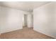 White bedroom with neutral carpet has a closet with mirrored doors and white trim at 4730 E Craig Rd # 2190, Las Vegas, NV 89115