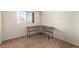 Bedroom features a built-in desk area and carpeted floors at 4730 E Craig Rd # 2190, Las Vegas, NV 89115