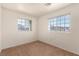Bedroom with carpet and two windows letting in natural light and views at 4730 E Craig Rd # 2190, Las Vegas, NV 89115