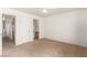 Bedroom with neutral walls and carpet has doorways to the hallway and ensuite bathroom at 4730 E Craig Rd # 2190, Las Vegas, NV 89115