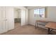 Bedroom includes carpet, a window, a built-in desk, and a sliding closet door at 4730 E Craig Rd # 2190, Las Vegas, NV 89115