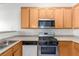 Kitchen with stainless steel appliances, countertops and wood cabinets at 4730 E Craig Rd # 2190, Las Vegas, NV 89115