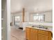 The kitchen area looks into the Gathering room with sliding glass doors to the outside at 4730 E Craig Rd # 2190, Las Vegas, NV 89115