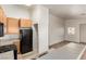 Kitchen with wood cabinets, stainless steel appliances, and adjacent space at 4730 E Craig Rd # 2190, Las Vegas, NV 89115
