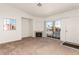 Bright living room features neutral carpet, built-in fireplace and sliding glass doors at 4730 E Craig Rd # 2190, Las Vegas, NV 89115
