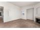 Spacious living room features neutral carpet, a fireplace, and a bright window for natural light at 4730 E Craig Rd # 2190, Las Vegas, NV 89115