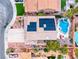 Aerial view of a home featuring solar panels, a pool, and a well-manicured backyard at 511 Beaconwood St, Henderson, NV 89052