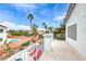 Balcony with red seating overlooking a pool and tropical landscaping at 511 Beaconwood St, Henderson, NV 89052