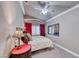 Cozy bedroom featuring a vaulted ceiling, plush carpet and a ceiling fan at 511 Beaconwood St, Henderson, NV 89052