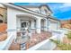 Inviting front porch with brick pavers, comfortable seating, and a charming water fountain feature at 511 Beaconwood St, Henderson, NV 89052