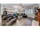 Spacious living room with dark leather furniture, a fireplace, and wood-style flooring at 511 Beaconwood St, Henderson, NV 89052