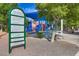Paseo Verde Park's vibrant blue playground, complete with slides and climbing structures, providing hours of fun at 511 Beaconwood St, Henderson, NV 89052