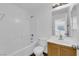 Bathroom featuring a shower-tub combo, a toilet, and a single-sink vanity at 5124 Veeder Crest St, North Las Vegas, NV 89081