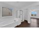 A bathroom with a tub, shower, and a window for natural light at 5124 Veeder Crest St, North Las Vegas, NV 89081