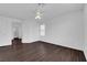 Spacious bedroom with wood-look floors and a ceiling fan at 5124 Veeder Crest St, North Las Vegas, NV 89081