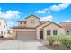 Charming two-story home with a well-manicured front yard and inviting entrance at 5124 Veeder Crest St, North Las Vegas, NV 89081