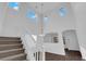 Well-lit entry showcasing staircase, high ceilings, and contemporary design at 5124 Veeder Crest St, North Las Vegas, NV 89081