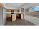 Modern kitchen features stainless steel appliances, wood cabinets, and sliding glass door at 5124 Veeder Crest St, North Las Vegas, NV 89081