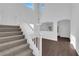 Bright living room featuring high ceilings, hardwood floors, staircase, and an open archway to the front entry at 5124 Veeder Crest St, North Las Vegas, NV 89081