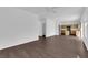 Open floor plan with kitchen view and hardwood floors creating a cohesive and inviting living space at 5124 Veeder Crest St, North Las Vegas, NV 89081