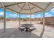 Exterior view of a metal shade structure with seating in a neighborhood park at 5124 Veeder Crest St, North Las Vegas, NV 89081