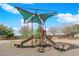 Community playground with slide, climbing structures, and sunshade for safe and enjoyable outdoor play for children at 5124 Veeder Crest St, North Las Vegas, NV 89081