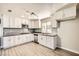 Modern kitchen with stainless steel appliances, gray backsplash, and updated cabinets at 5310 Plainfield Dr, Las Vegas, NV 89142