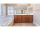 Bright bathroom with double vanity and soaking tub at 63 Crescent Palm Ct, Henderson, NV 89002