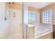 Bright bathroom with walk-in shower and soaking tub at 63 Crescent Palm Ct, Henderson, NV 89002