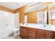 Well-lit bathroom with a double sink vanity and a shower-tub combo at 63 Crescent Palm Ct, Henderson, NV 89002